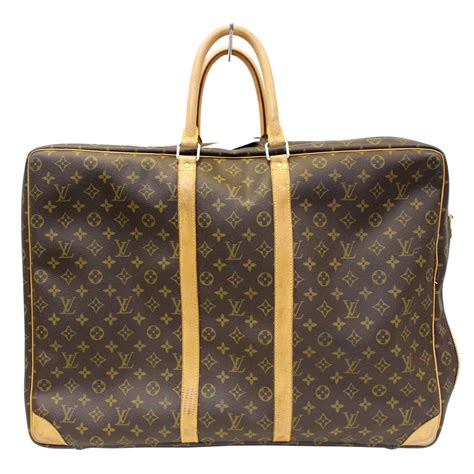 louis vuitton travel suitcase.